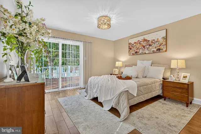 a bed room with a bed and a painting on the wall