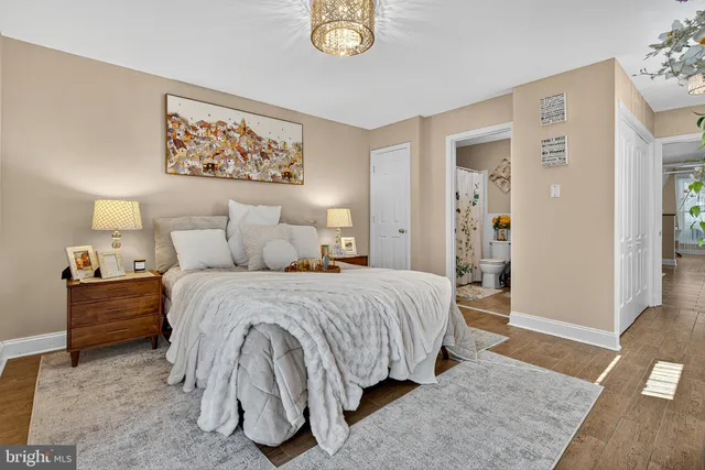 a bedroom with a bed and a couch