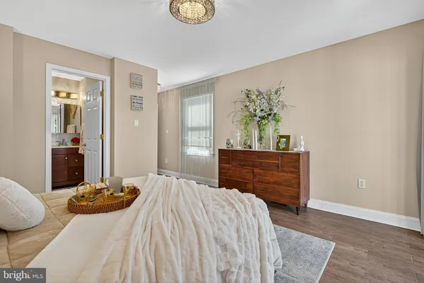 a bed room with a bed and a dresser