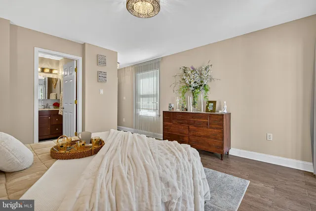 a bed room with a bed and a dresser