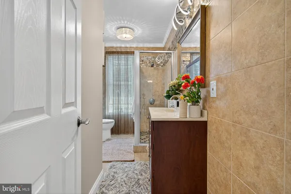 a view of a hallway and a dining room