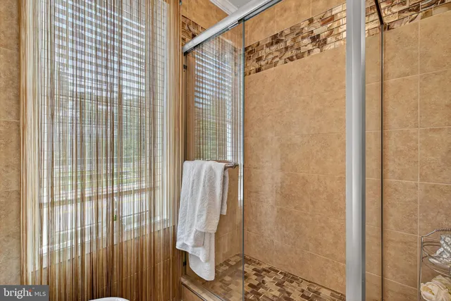 a bathroom with a shower and a sink