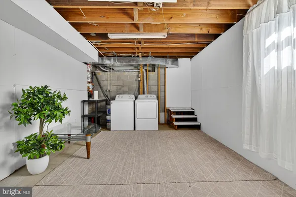 a view of a small house with a tree