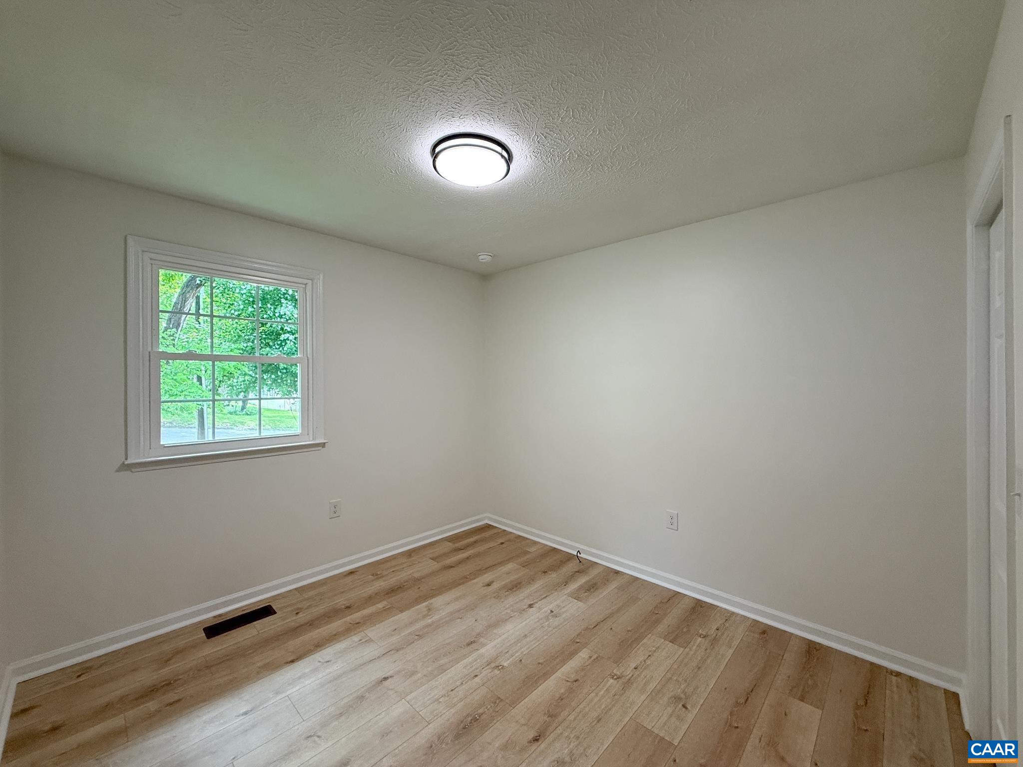 1207 4th Street Waynesboro, VA 22980 - Photo 11 of 18 an empty room with a window
