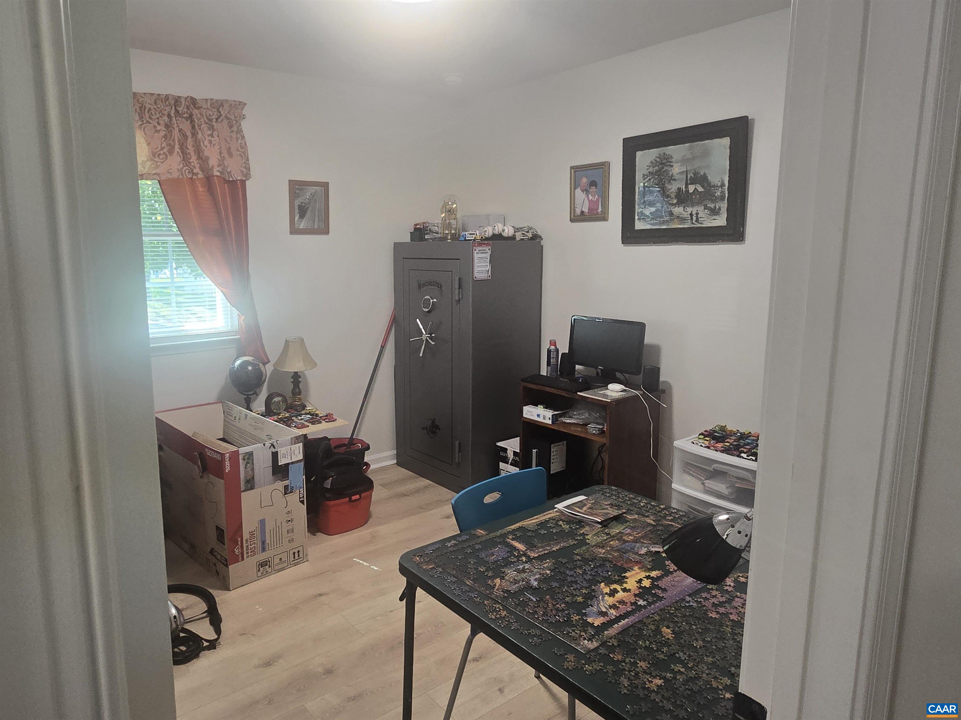 1207 4th Street Waynesboro, VA 22980 - Photo 12 of 18 a living room with furniture and a rug
