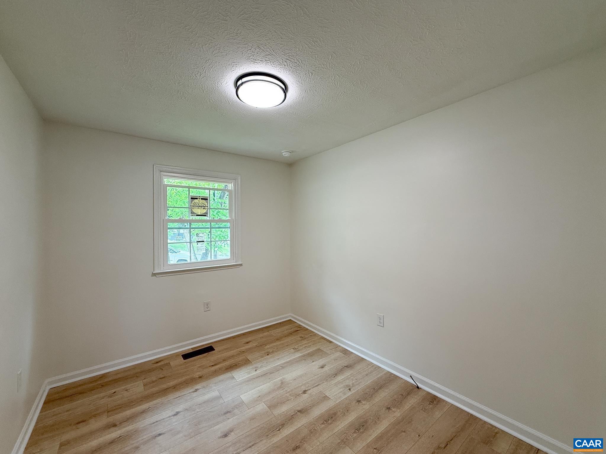 1207 4th Street Waynesboro, VA 22980 - Photo 13 of 18 an empty room with a window