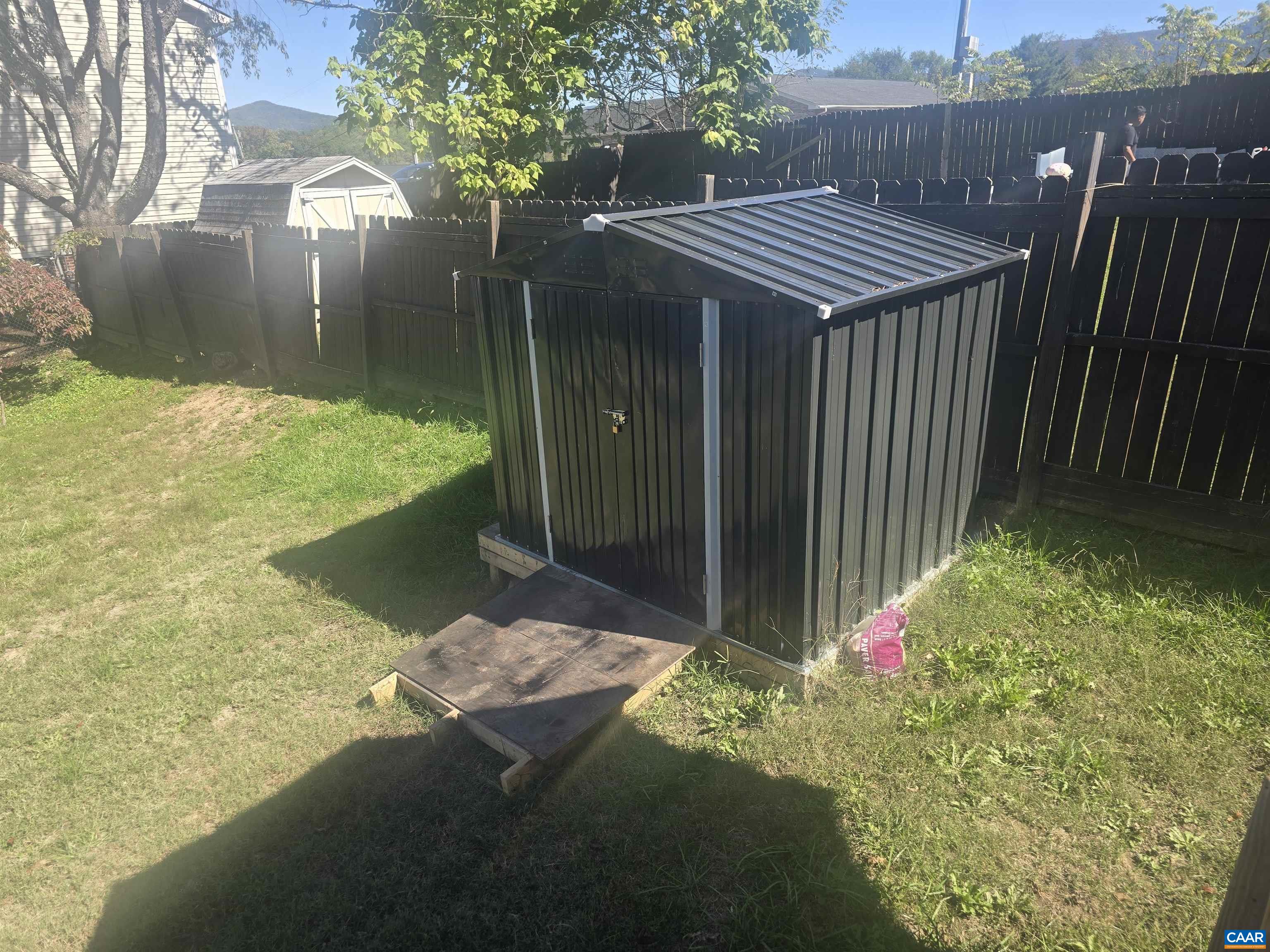 1207 4th Street Waynesboro, VA 22980 - Photo 16 of 18 a view of backyard with table and chairs and wooden fence
