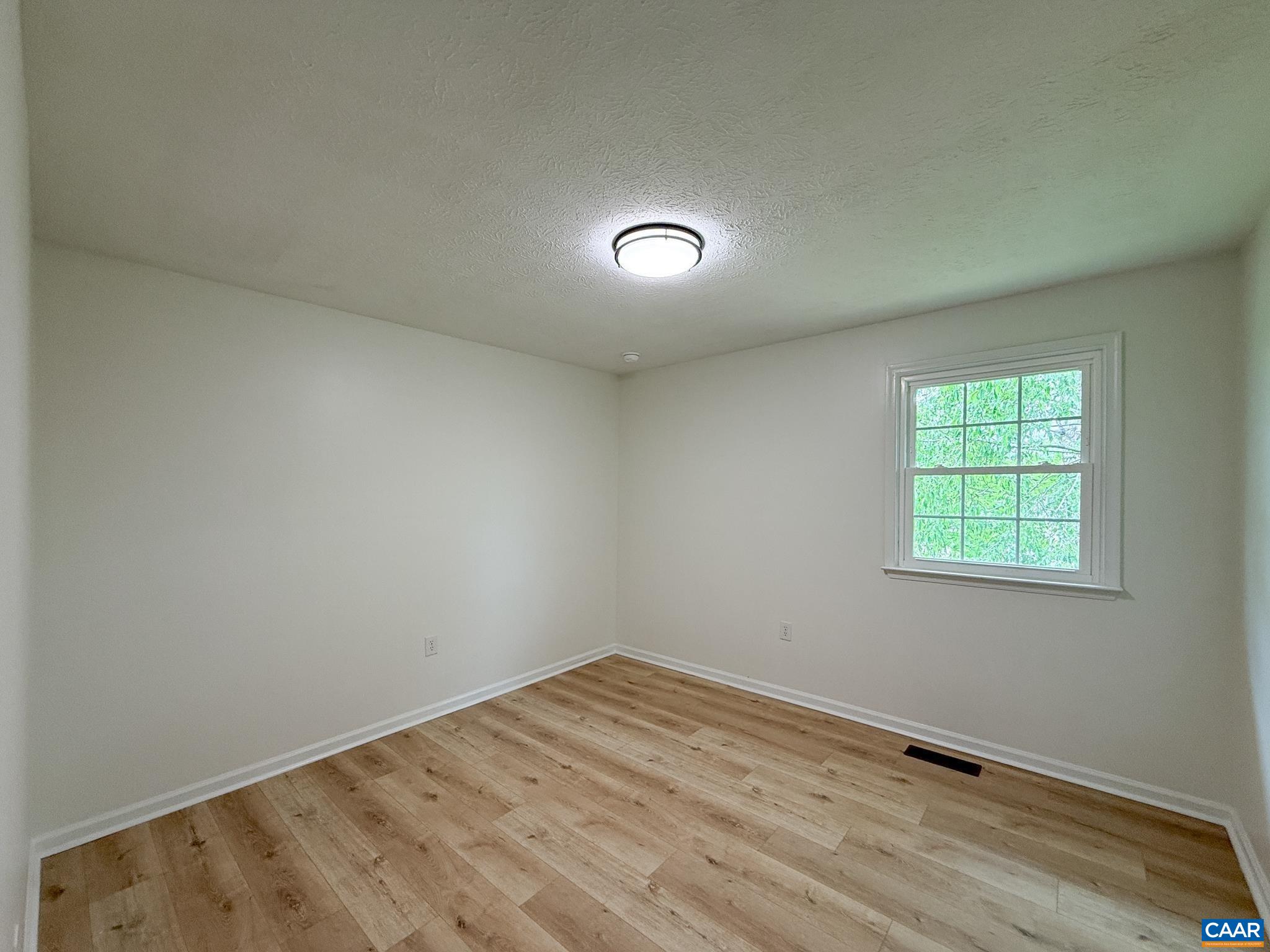 1207 4th Street Waynesboro, VA 22980 - Photo 9 of 18 an empty room with a window
