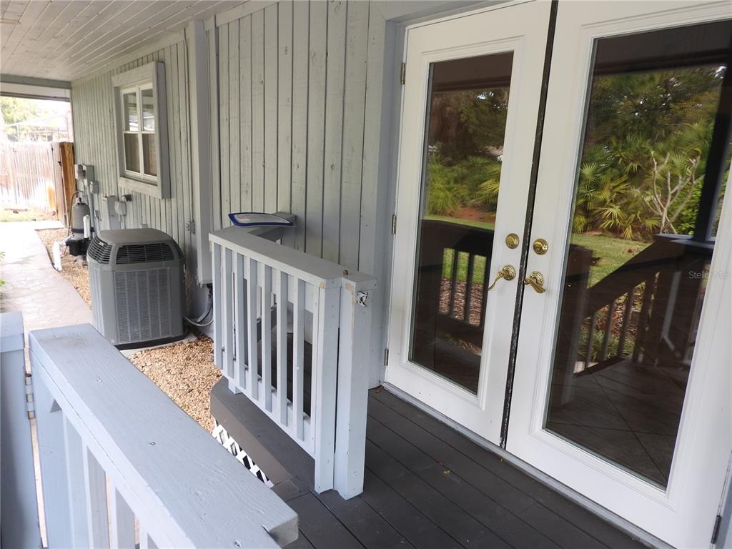 8308 Beasley Road Tampa, FL 33615 - Photo 12 of 49 a view of staircase with open kitchen view