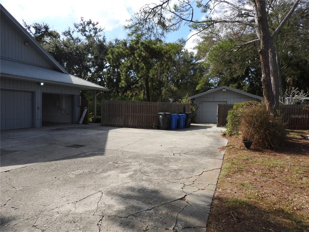 8308 Beasley Road Tampa, FL 33615 - Photo 18 of 49 a view of a backyard with a large tree