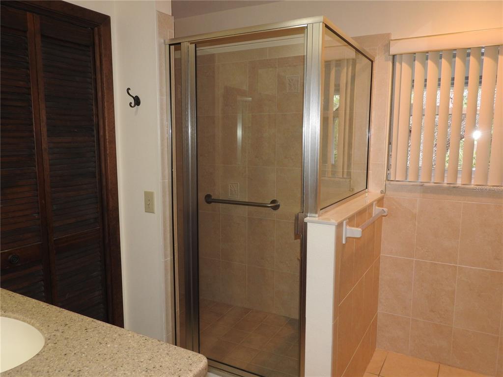 8308 Beasley Road Tampa, FL 33615 - Photo 31 of 49 a bathroom with a shower and a sink