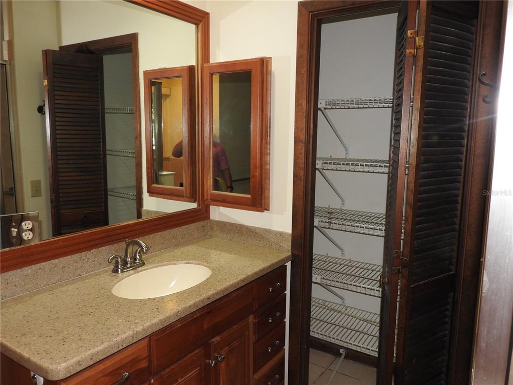 8308 Beasley Road Tampa, FL 33615 - Photo 32 of 49 a bathroom with a sink and a mirror