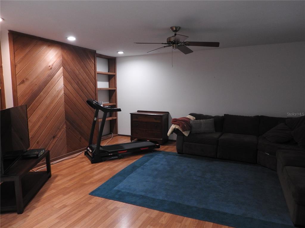 8308 Beasley Road Tampa, FL 33615 - Photo 36 of 49 a living room with furniture and a flat screen tv