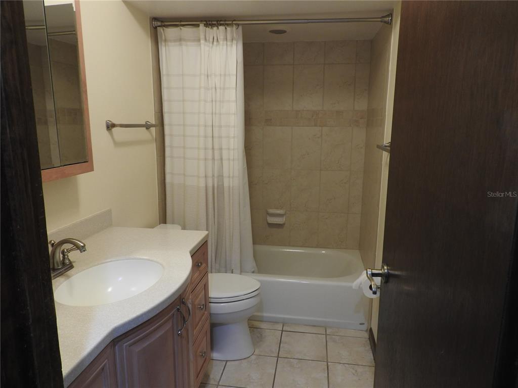 8308 Beasley Road Tampa, FL 33615 - Photo 38 of 49 a bathroom with a sink a toilet and shower