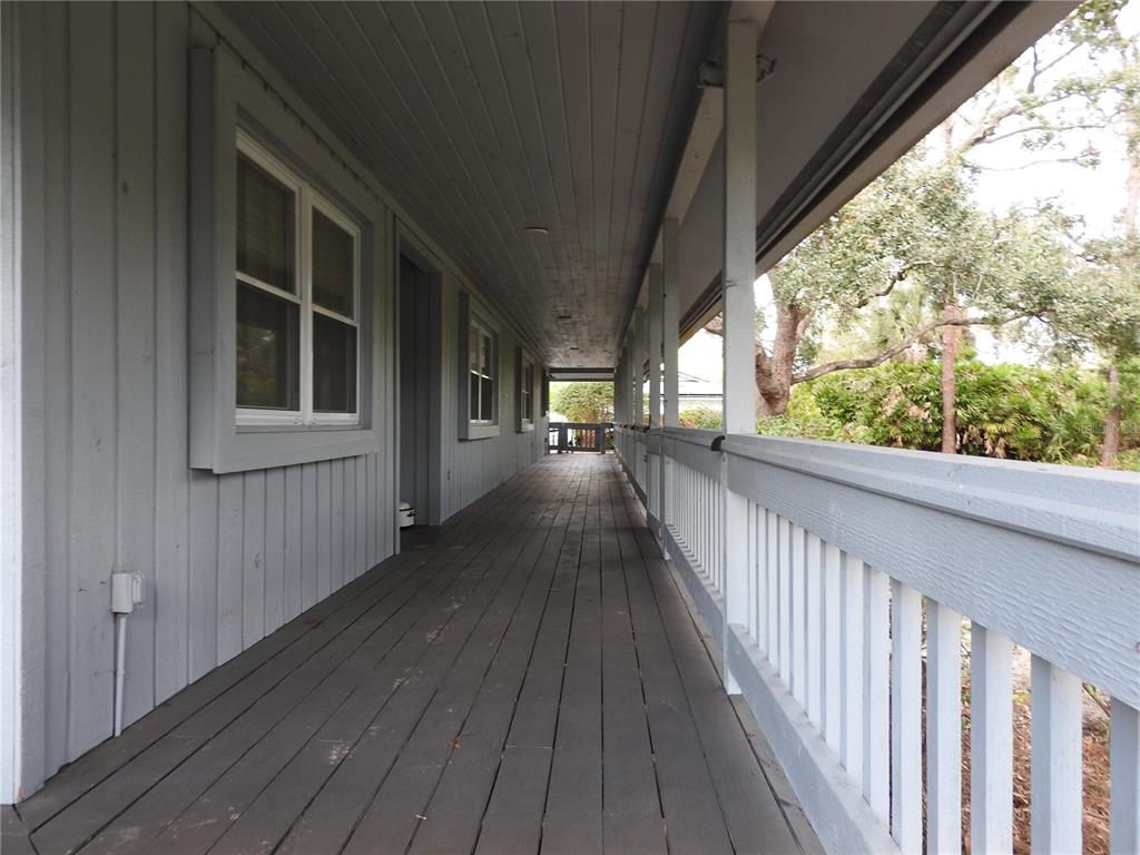 8308 Beasley Road Tampa, FL 33615 - Photo 10 of 49 a view of balcony with wooden floor