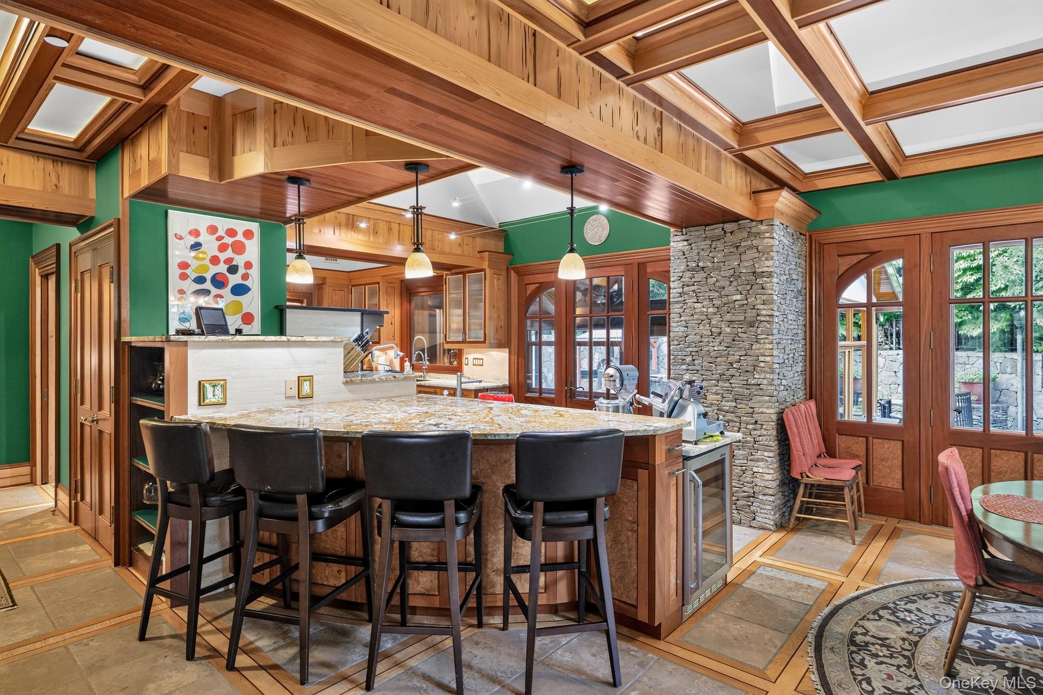 23 Inningwood Road Ossining, NY 10562 - Photo 24 of 50 Kitchen island with granite countertop, integrated beverage cooler, and pendant lighting