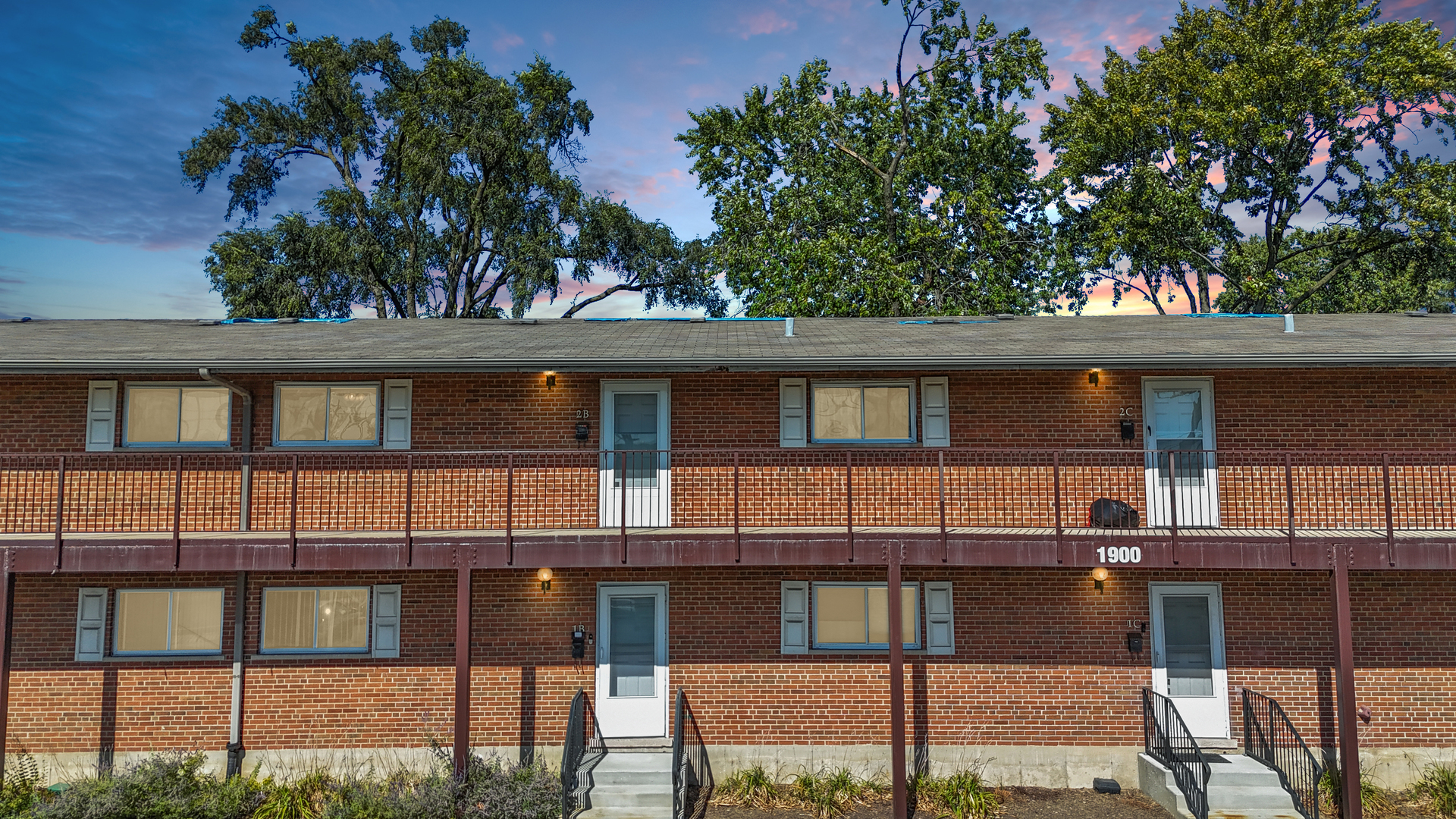 1900 Knights Bridge Drive, Unit 2B Mount Prospect, IL 60056 - Photo 3 of 16 a front view of a house with a balcony