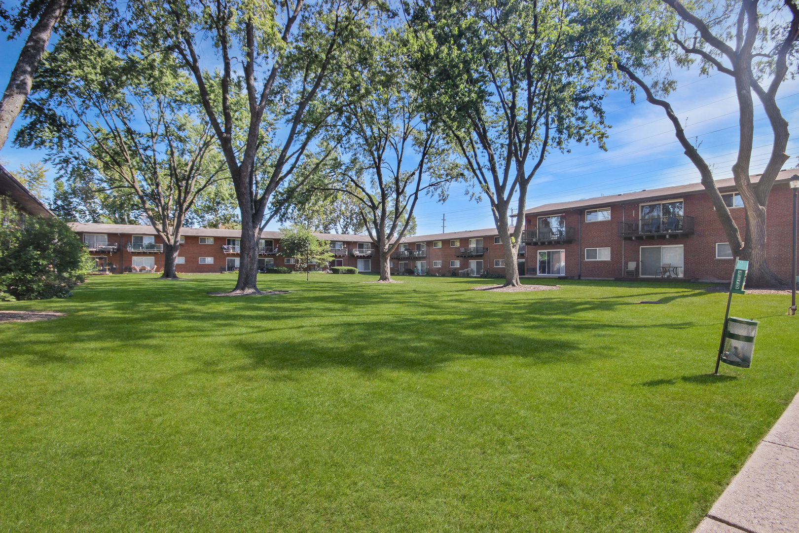 1900 Knights Bridge Drive, Unit 2B Mount Prospect, IL 60056 - Photo 4 of 16 a view of a park with large trees