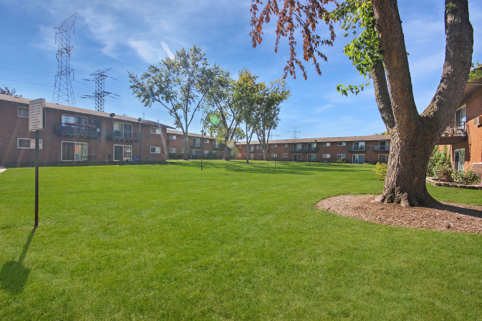1900 Knights Bridge Drive, Unit 2B Mount Prospect, IL 60056 - Photo 5 of 16 a view of a yard with a house in the background