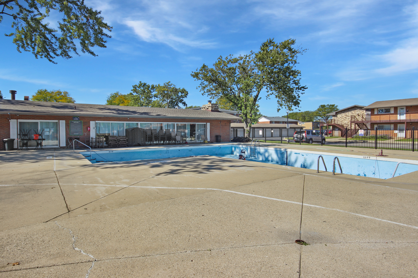 1900 Knights Bridge Drive, Unit 2B Mount Prospect, IL 60056 - Photo 7 of 16 a view of a swimming pool with a patio
