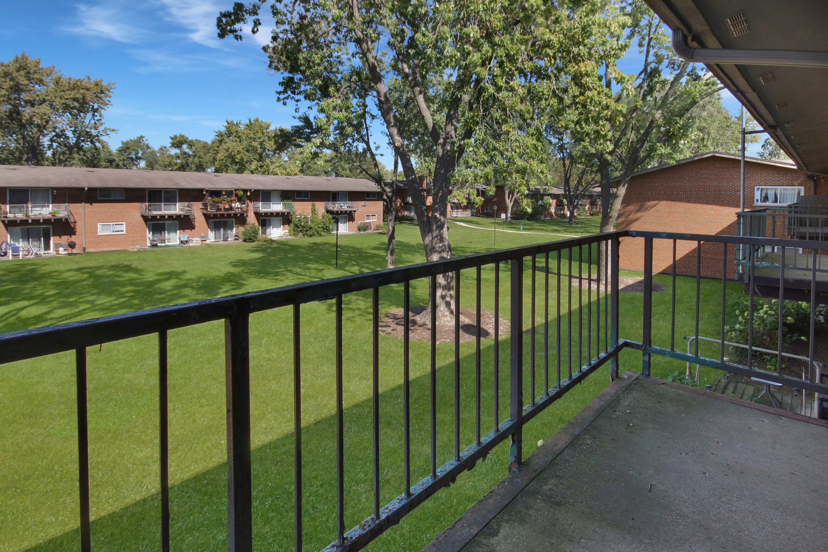 1900 Knights Bridge Drive, Unit 2B Mount Prospect, IL 60056 - Photo 8 of 16 a view of a brick house with a large windows