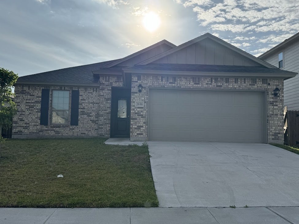 2658 Westeros Street Corpus Christi, TX 78415 - Photo 1 of 13 a front view of a house with a garden
