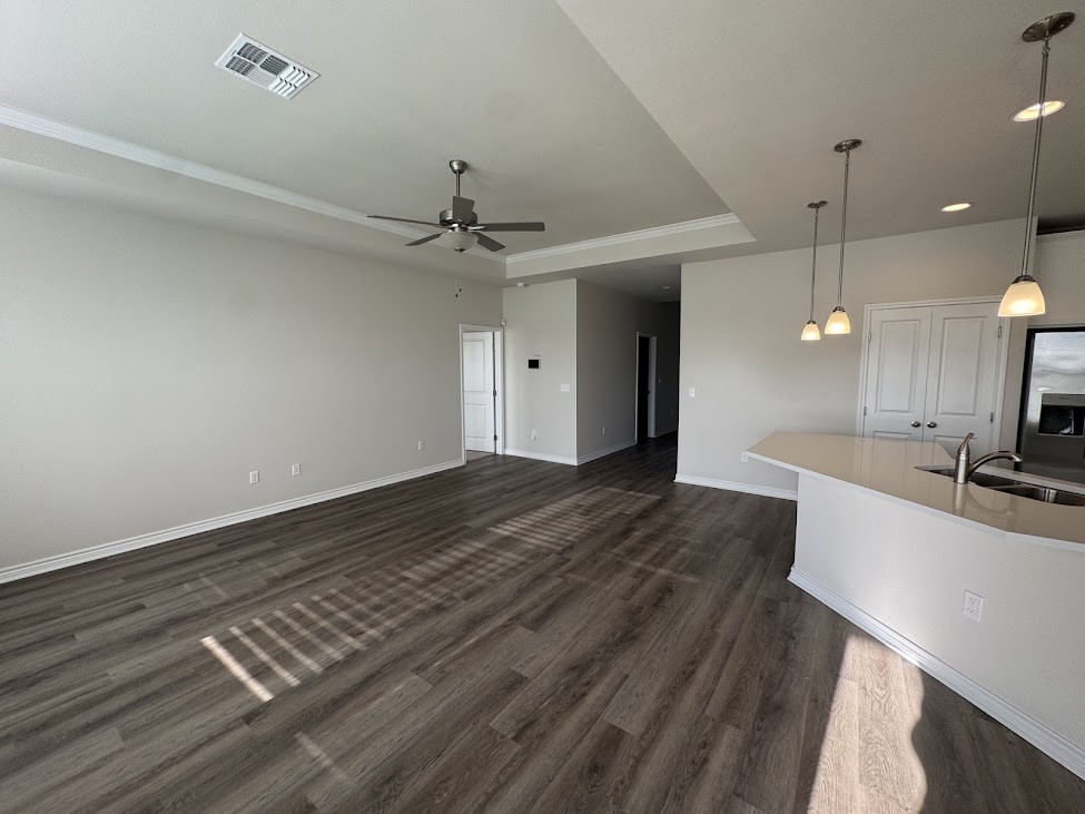 2658 Westeros Street Corpus Christi, TX 78415 - Photo 2 of 13 a spacious bathroom with a granite countertop sink and a mirror