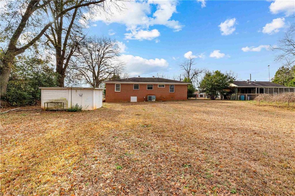 104 Denham Street Thomaston, GA 30286 - Photo 26 of 26 a view of a house with a yard and sitting area