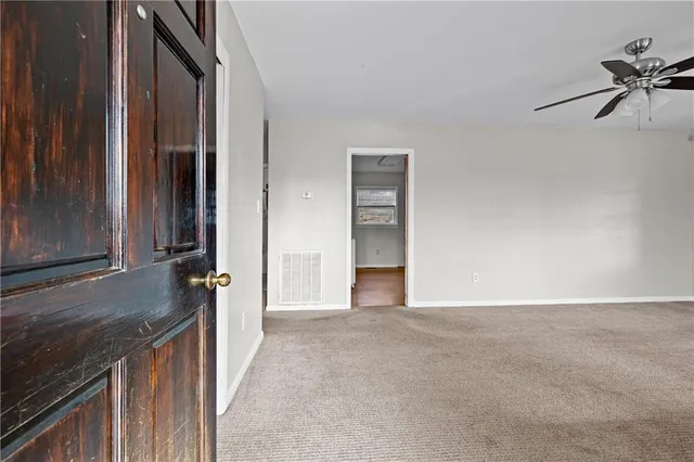 a view of a kitchen from the hallway