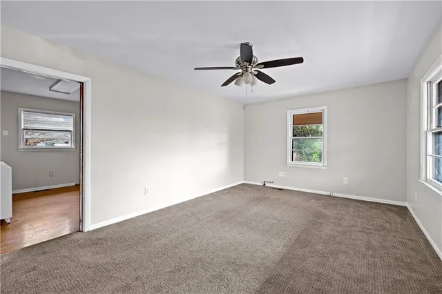 a view of empty room with windows
