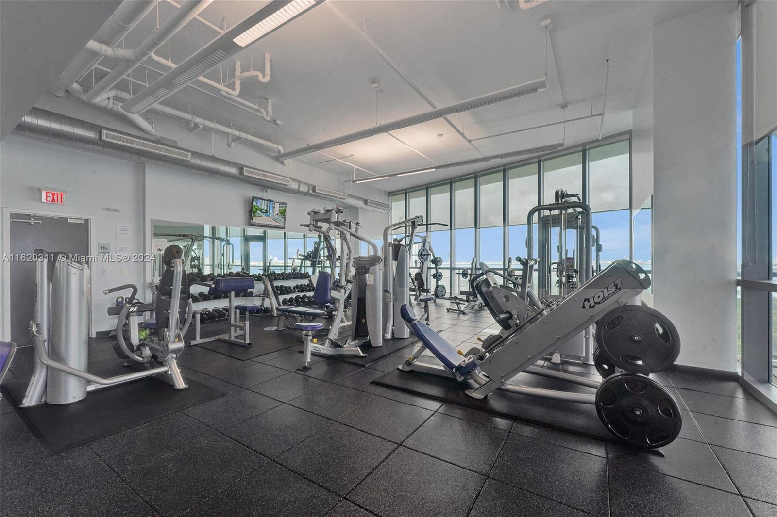 888 Biscayne Boulevard, Unit 509 Miami, FL 33132 - Photo 18 of 32 a view of a room with gym equipment