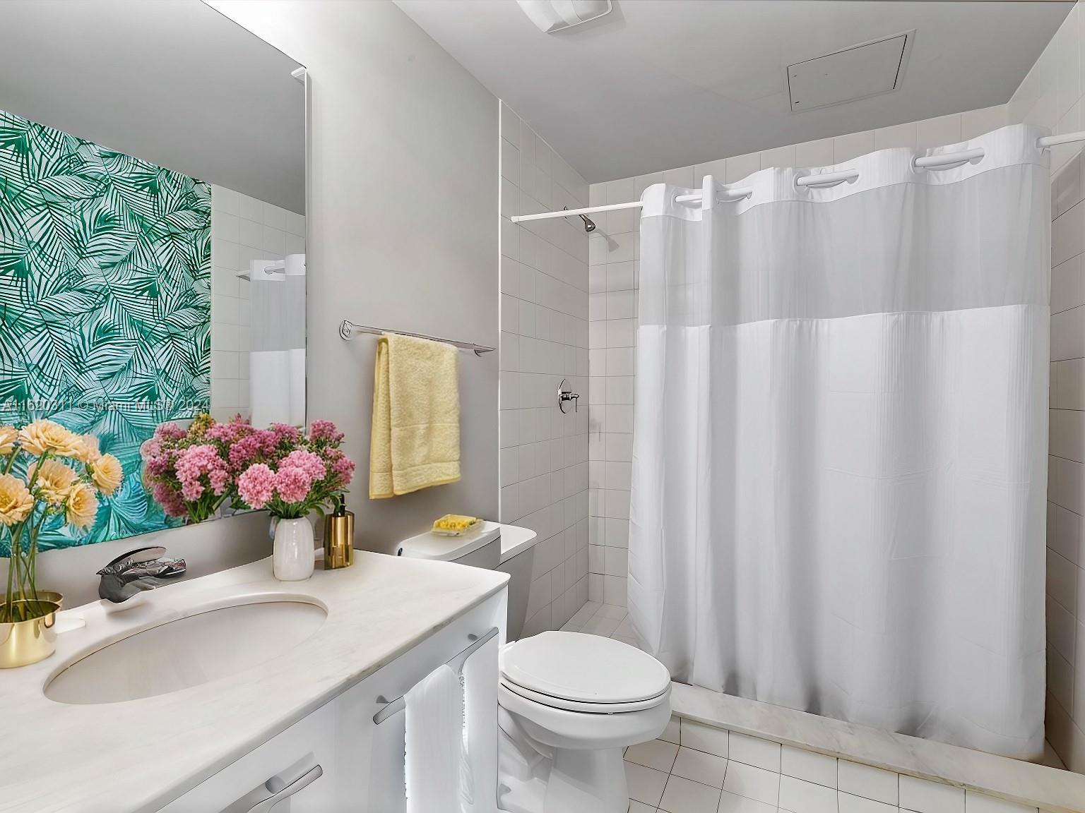 888 Biscayne Boulevard, Unit 509 Miami, FL 33132 - Photo 9 of 32 a bathroom with a sink toilet and shower