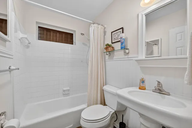 a bathroom with a sink toilet and a bathtub