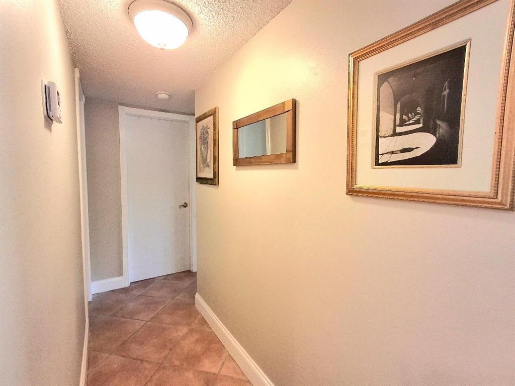 1421 South Ocean Boulevard, Unit 206 Pompano Beach, FL 33062 - Photo 12 of 40 a view of a hallway