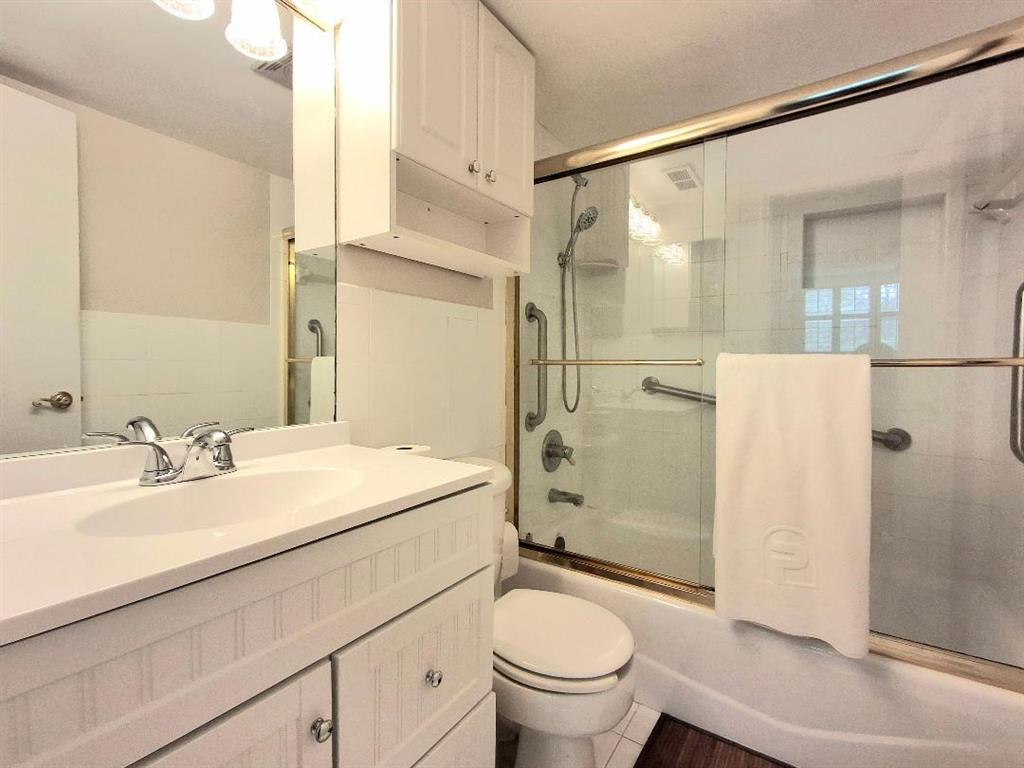 1421 South Ocean Boulevard, Unit 206 Pompano Beach, FL 33062 - Photo 16 of 40 a bathroom with a sink a toilet and shower