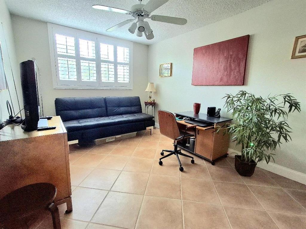 1421 South Ocean Boulevard, Unit 206 Pompano Beach, FL 33062 - Photo 17 of 40 a view of a livingroom with workspace and a window