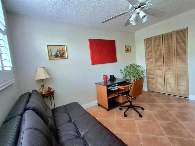 a workspace with furniture and window