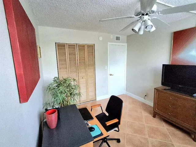 a livingroom with furniture and a flat screen tv
