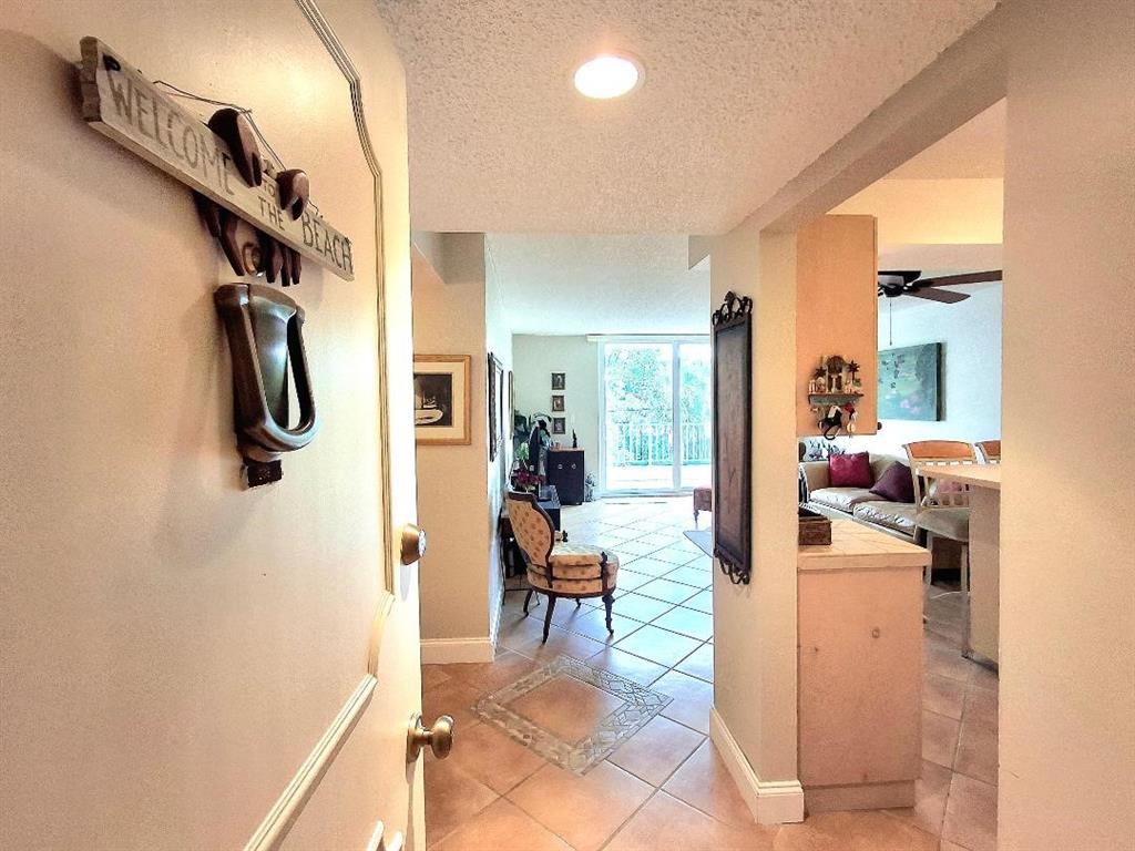 1421 South Ocean Boulevard, Unit 206 Pompano Beach, FL 33062 - Photo 2 of 40 a view of a living room and bathroom