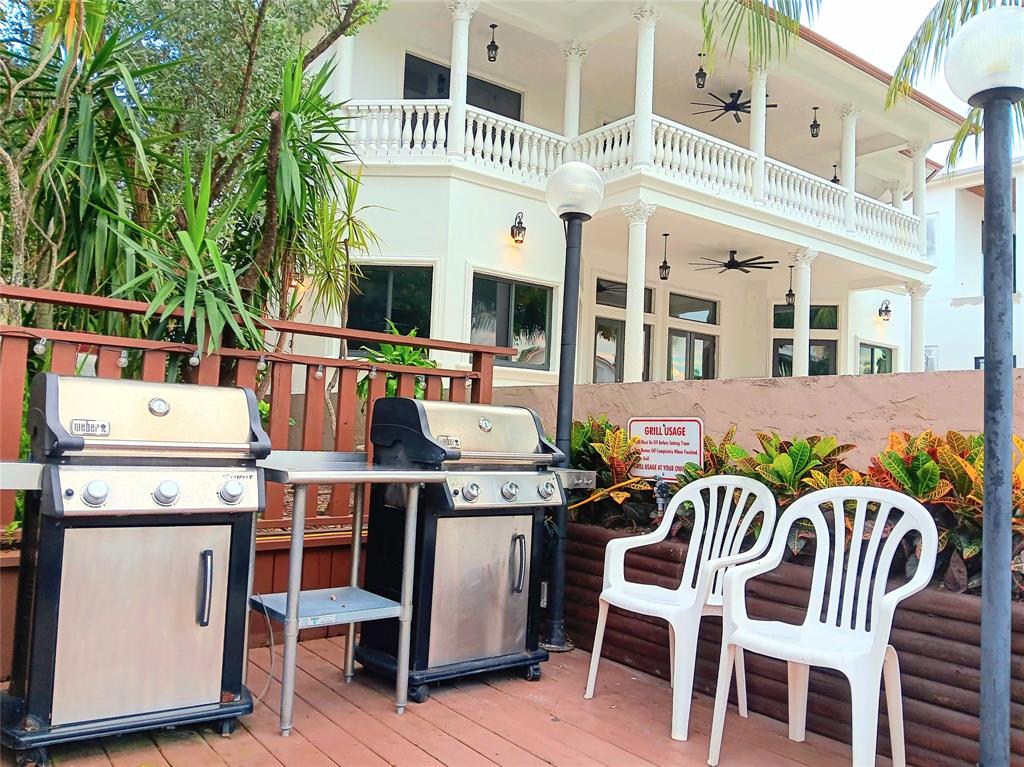 1421 South Ocean Boulevard, Unit 206 Pompano Beach, FL 33062 - Photo 25 of 40 a view of a patio with table and chairs