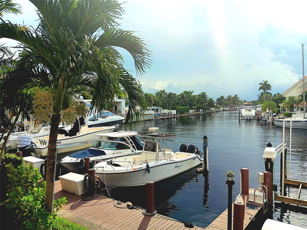 1421 South Ocean Boulevard, Unit 206 Pompano Beach, FL 33062 - Photo 28 of 40 a view of a lake with couches and wooden floor