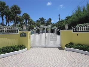 1421 South Ocean Boulevard, Unit 206 Pompano Beach, FL 33062 - Photo 29 of 40 a balcony with trees in front of it