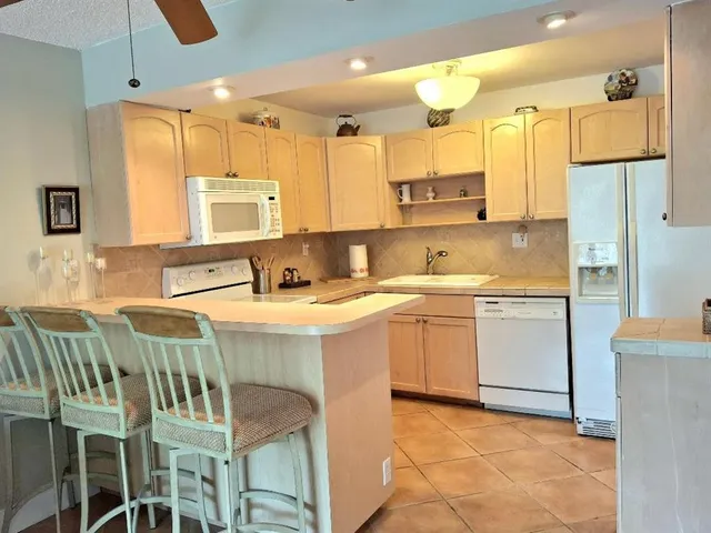 a kitchen with a sink counter top space and appliances