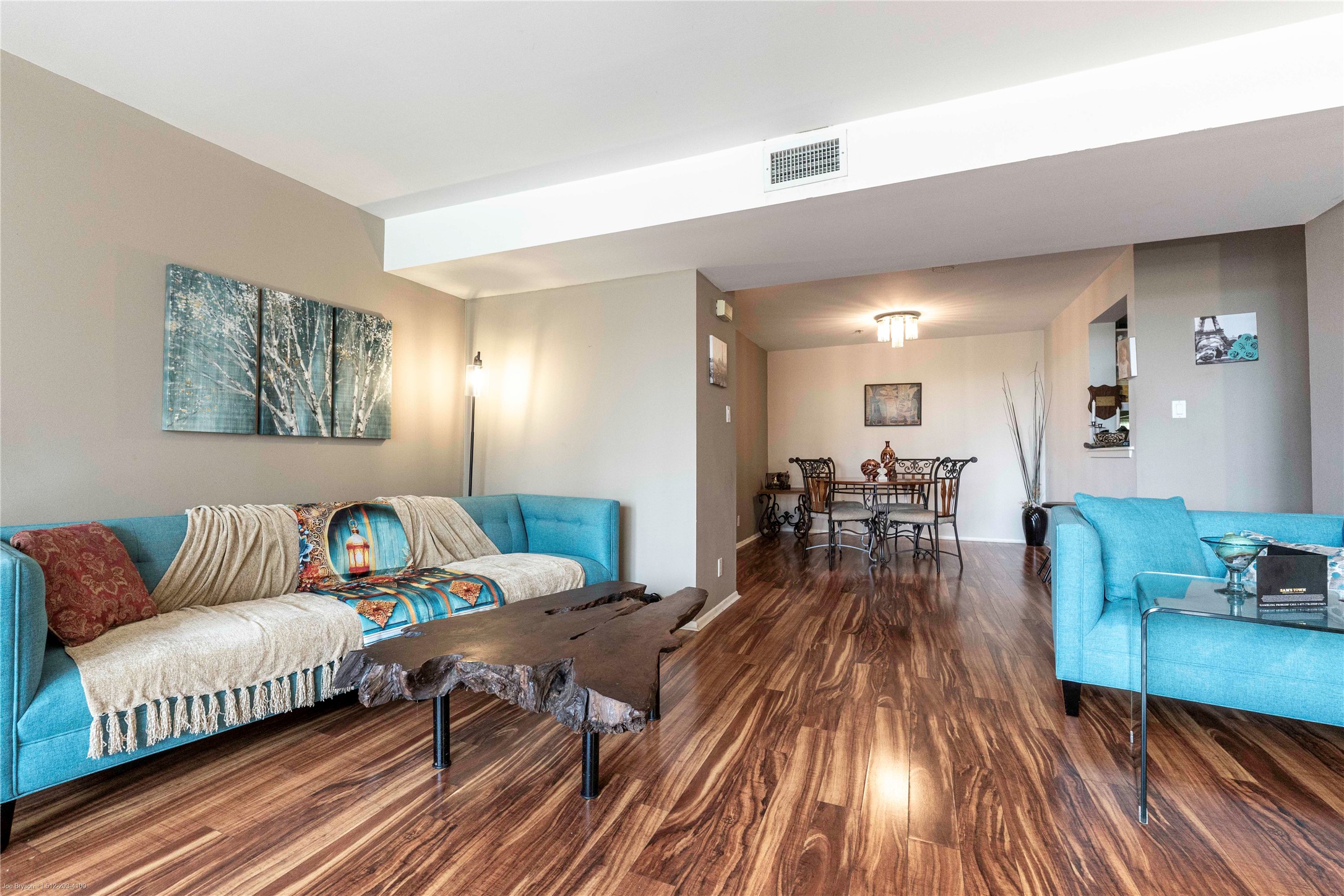 40 North Interstate Highway 35, Unit 6C1 Austin, TX 78701 - Photo 23 of 37 a living room with furniture and wooden floor