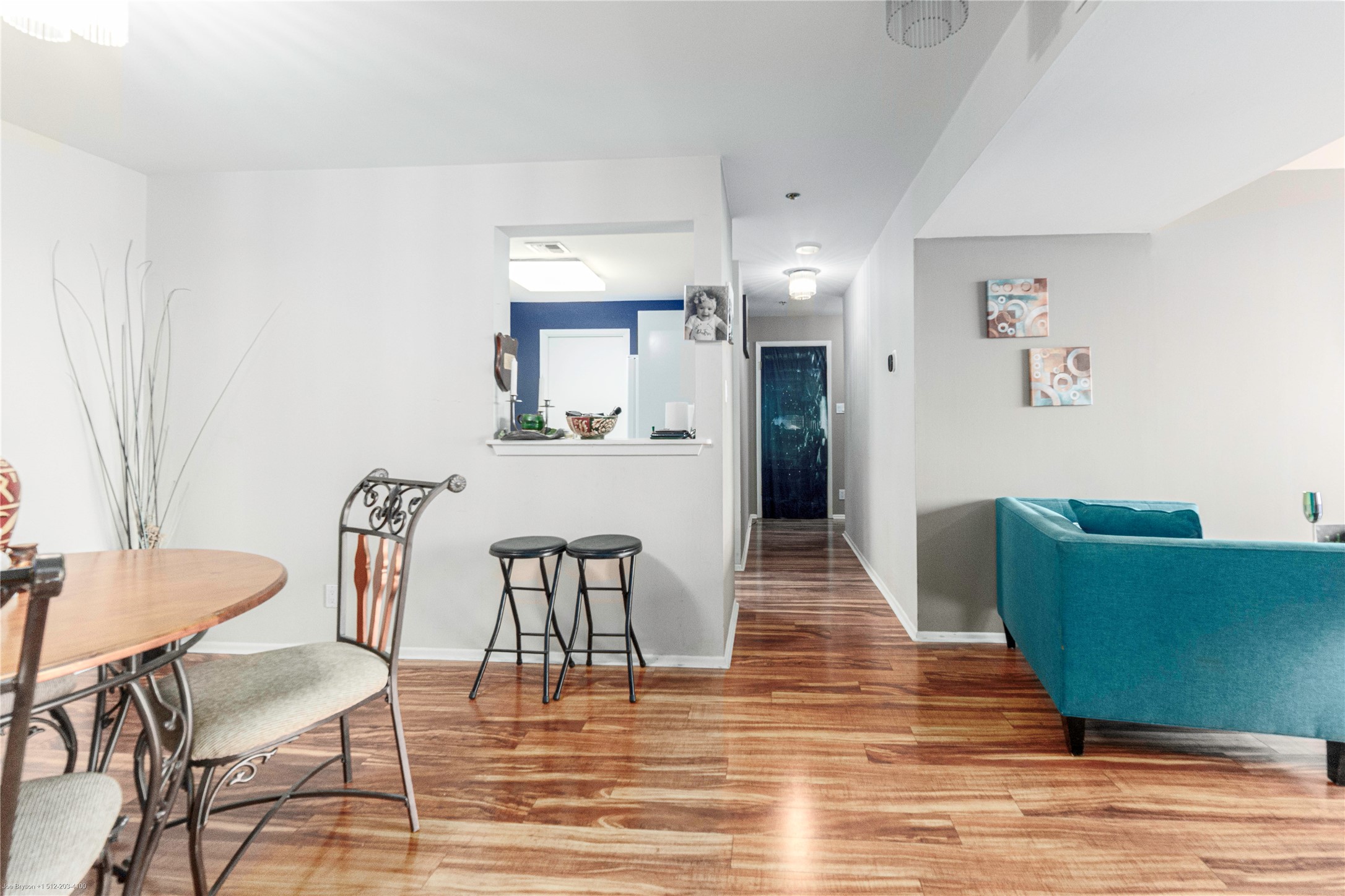 40 North Interstate Highway 35, Unit 6C1 Austin, TX 78701 - Photo 26 of 37 a living room with furniture and a wooden floor