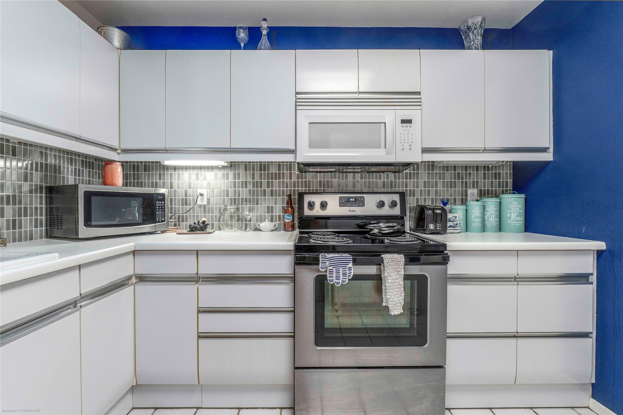 40 North Interstate Highway 35, Unit 6C1 Austin, TX 78701 - Photo 3 of 37 a kitchen with stainless steel appliances granite countertop a stove and a microwave