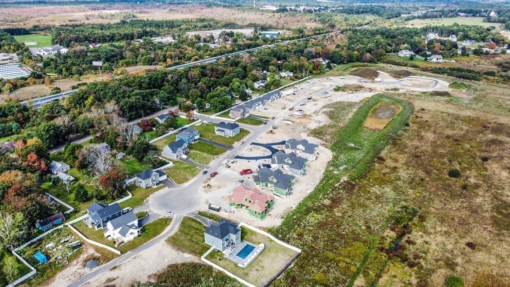 24 Metacomet Road, Unit 24 West Bridgewater, MA 02379 - Photo 5 of 7 an aerial view of a house with a yard
