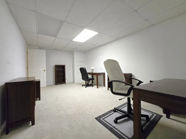 a view of a workspace with furniture