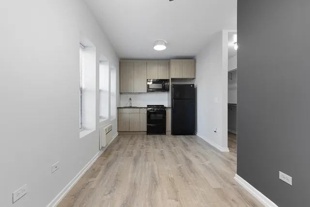 a view of kitchen with wooden floor