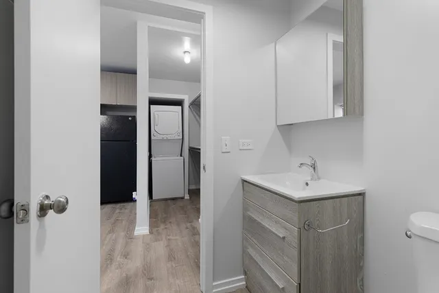 a bathroom with a sink a toilet and mirror